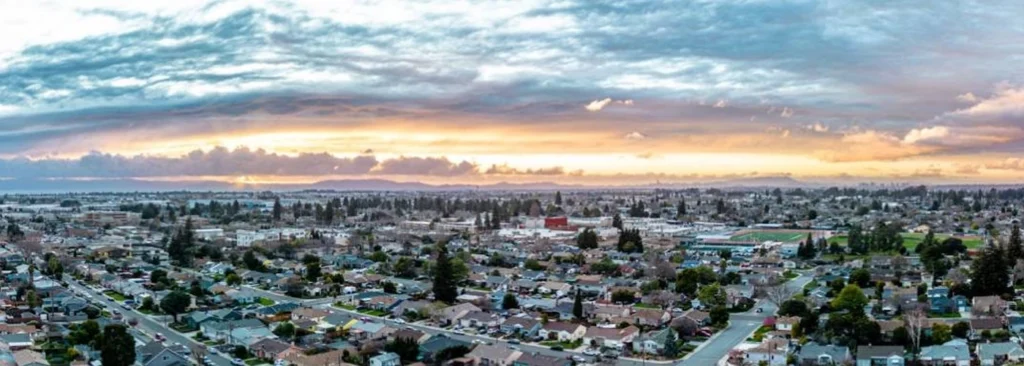 Aerial view of San Leandro CA along the Bay shoreline — hair transplant clinic nearby at Blackhawk Hair Restoration Danville